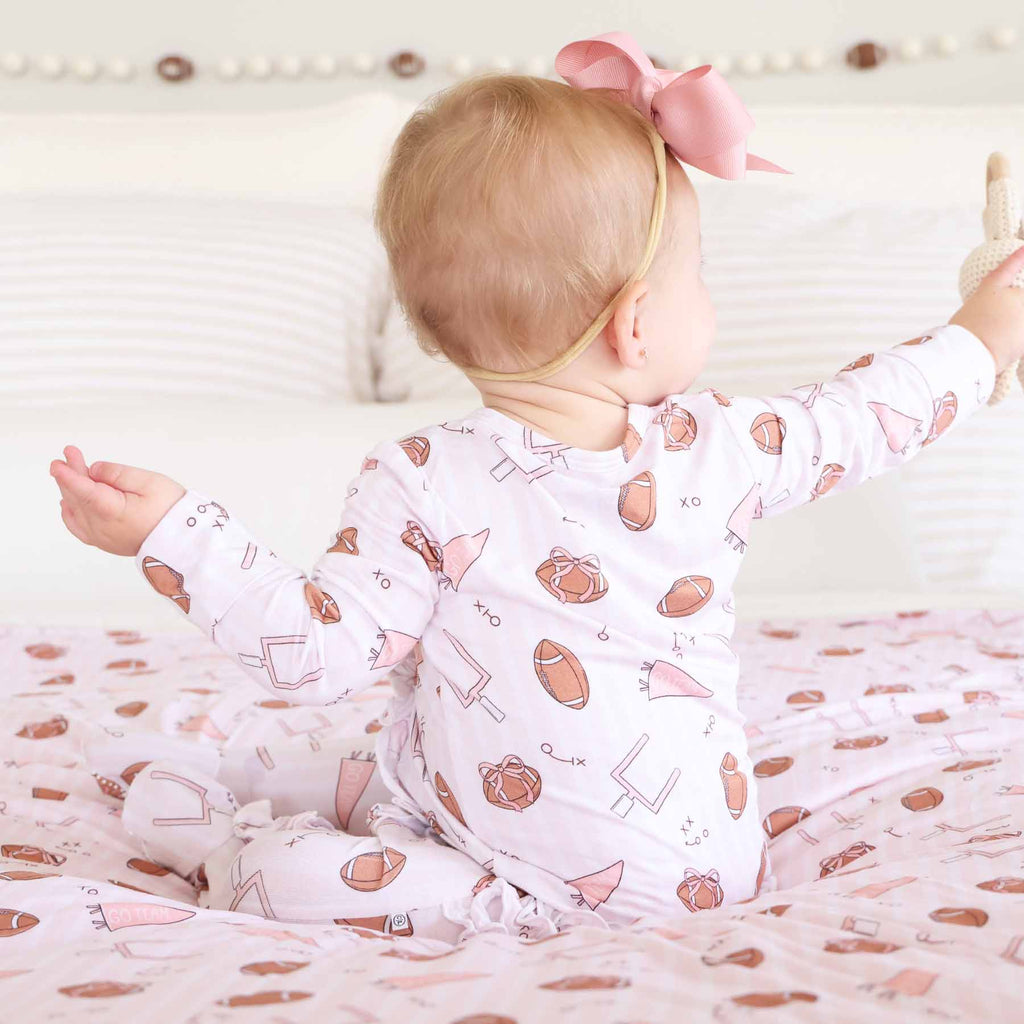 Tiny Touchdowns Ruffle Zipper Footie | Pink