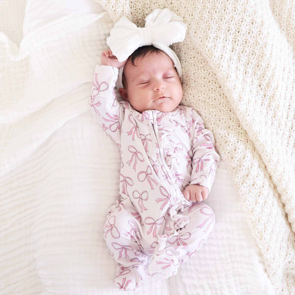 Blushing Bows Ruffle Zipper Footie